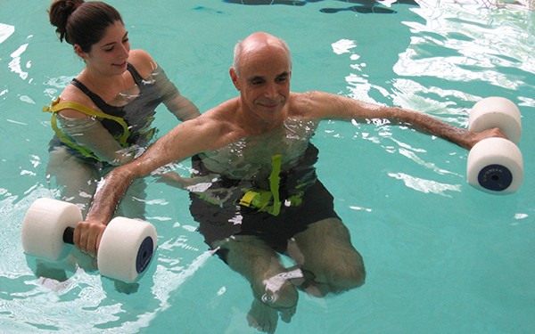 man receiving aquatic therapy